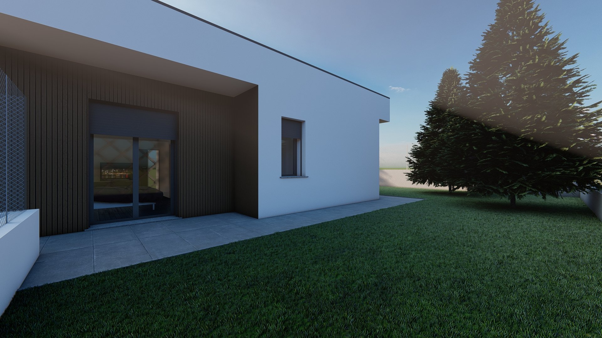 Modern white and dark house with large patio overlooking green lawn and evergreen trees at dusk